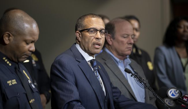 FILE - In this Nov. 21, 2019, file photo, Detroit Police Chief James Craig, second left, speaks to the media at Detroit Public Safety Headquarters in Detroit. Investigators looking into potential wrongdoing by members of the Detroit Police Department's narcotics unit have found that some officers stole from drug dealers, planted drugs on suspects and lied to prosecutors to get search warrants, the city's police chief said. (David Guralnick/Detroit News via AP, File)
