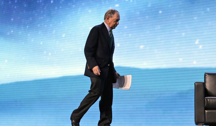 Democratic Presidential candidate and former New York City Mayor Michael Bloomberg walks on stage before taking part in a conversation with former California Gov. Jerry Brown at the American Geophysical Union fall meeting Wednesday, Dec. 11, 2019, in San Francisco. Bloomberg made his first visit to California as a Democratic presidential candidate, appearing earlier with the mayor of Stockton who's championed universal basic income. Bloomberg and Brown talked about America's Pledge, bringing together leaders to ensure the U.S. remains a global leader in reducing emissions and delivering the goals of the Paris Agreement. (AP Photo/Eric Risberg)