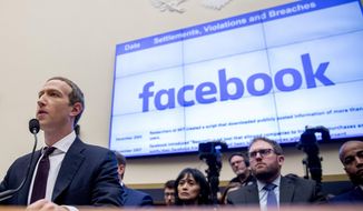 This Oct. 23, 2019, photo shows Facebook CEO Mark Zuckerberg testifying before a House Financial Services Committee hearing on Capitol Hill in Washington. (AP Photo/Andrew Harnik) **FILE**