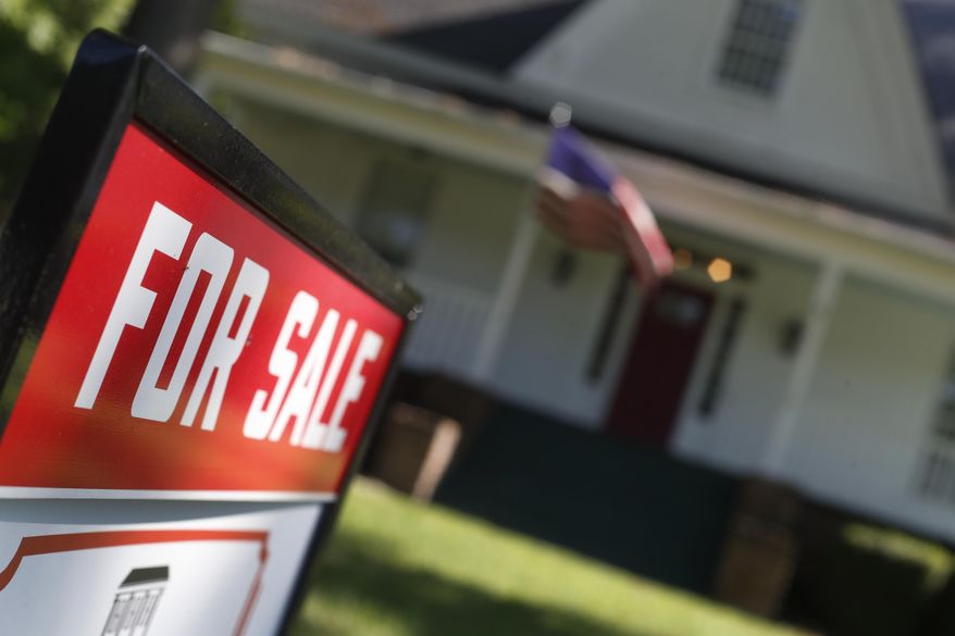 FILE - This June 20, 2019, file photo shows an existing home is offered for sale in Rutledge, Ga. On Thursday, Dec. 12, Freddie Mac reports on this week's average U.S. mortgage rates. (AP Photo/John Bazemore, File)