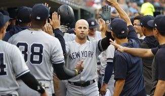 FILE - In this Sept. 10, 2019, file photo, New York Yankees&#x27; Brett Gardner celebrates his solo home run in the second inning of a baseball game against the Detroit Tigers, in Detroit. Outfielder Brett Gardner is staying with the New York Yankees after the best offensive season of his career, agreeing to a one-year contract that guarantees $12.5 million, a person familiar with the negotiations told The Associated Press. The person spoke on condition of anonymity Thursday, Dec. 12, 2019, because  the agreement had not be announced. (AP Photo/Paul Sancya, File)