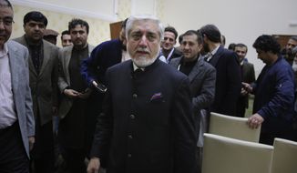 Afghan presidential candidate Abdullah Abdullah, leaves after addressing the media following a conference with his party members and few candidates in Kabul, Afghanistan, Friday, Dec. 13, 2019. Afghanistan&#39;s leading presidential candidate, Abdullah Abdullah, announced temporary truce, agreeing to allow ballot recount Sunday in provinces where his supporters had stopped the process for almost a month. (AP Photo/Altaf Qadri)