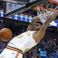 Golden State Warriors forward Marquese Chriss dunks against the Utah Jazz in the first half during an NBA basketball game Friday, Dec. 13, 2019, in Salt Lake City. (AP Photo/Rick Bowmer)