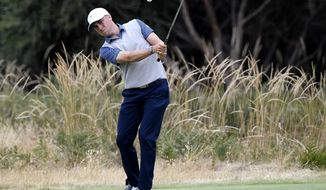 U.S. team player Justin Thomas chips onto the 8th green in their foursomes match during the President&#39;s Cup golf tournament at Royal Melbourne Golf Club in Melbourne, Friday, Dec. 13, 2019. (AP Photo/Andy Brownbill)