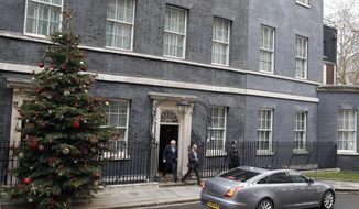 Britain&#39;s Prime Minister Boris Johnson leaves number 10 Downing Street in London, Friday, Dec. 13, 2019 on his way to meet Queen Elizabeth II to seek her approval to form a new government. Prime Minister Boris Johnson&#39;s Conservative Party has won a solid majority of seats in Britain&#39;s Parliament — a decisive outcome to a Brexit-dominated election that should allow Johnson to fulfill his plan to take the U.K. out of the European Union next month. (AP Photo/Thanassis Stavrakis)