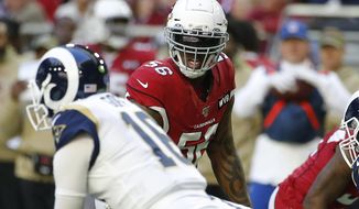 FILE - In this Dec. 1, 2019, file photo, Arizona Cardinals outside linebacker Terrell Suggs (56) lines up against the Los Angeles Rams during the first half of an NFL football game in Glendale, Ariz. The Cardinals have released the veteran linebacker on Friday, Dec. 13, 2019, with three games remaining in a disappointing season for both the player and the team.(AP Photo/Rick Scuteri)