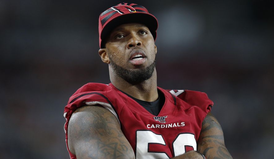 FILE - In this Aug. 15, 2019, file photo, Arizona Cardinals linebacker Terrell Suggs watches during the second half of an NFL preseason football game against the Oakland Raiders in Glendale, Ariz. The Cardinals have released the veteran linebacker on Friday, Dec. 13, 2019, with three games remaining in a disappointing season for both the player and the team. (AP Photo/Ralph Freso, File)