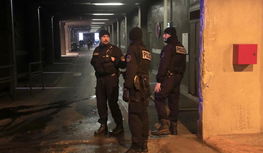 Police officers patrol in a tunnel under La Defense business district after a man threatened officers Friday, Dec.13, 2019 in Paris. Paris police say officers "neutralized" a man who threatened officers with a knife Friday morning in the French capital's main business district. (AP Photo/Michel Euler)
