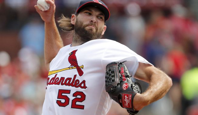 FILE - In this Sept. 15, 2019, file photo, St. Louis Cardinals starting pitcher Michael Wacha throws during the first inning of a baseball game against the Milwaukee Brewers in St. Louis. The former All-Star right-hander and the New York Mets finalized a $3 million, one-year contract that includes $8 million in performance bonuses on Friday, Dec. 13, 2019. Wacha can earn $7 million under a points system and $1 million for relief appearances. (AP Photo/Jeff Roberson, File)