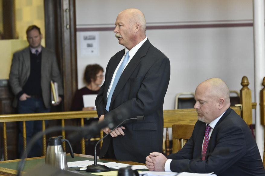 In this Thursday, Dec. 12, 2019, photo Roger Thompson, former Madison County Sheriff, appears before Judge Kathy Seeley Thursday in the Lewis and Clark County Courthouse in Helena, Mont. (Thom Bridge/Independent Record via AP)