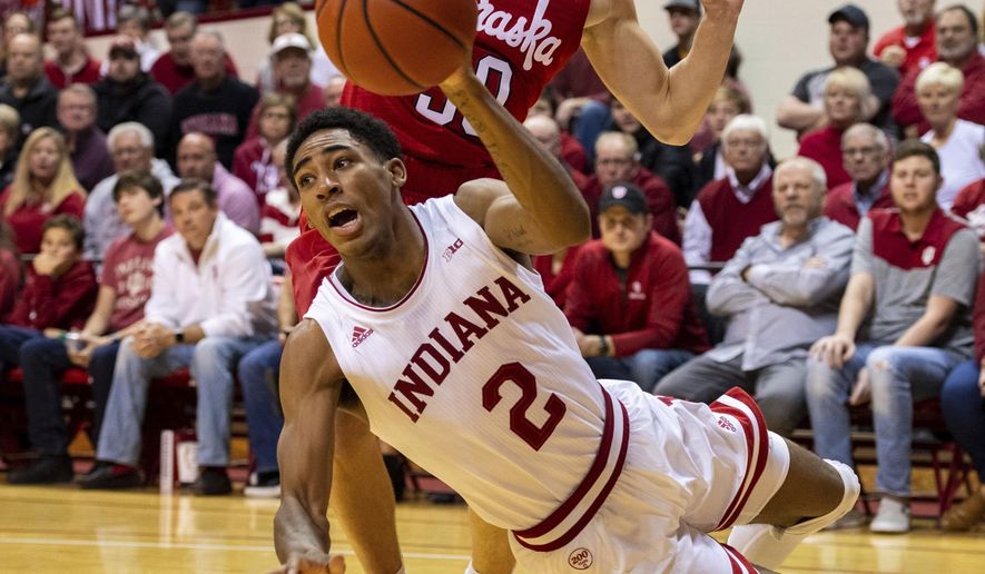 Indiana guard Armaan Franklin (2) tries to get a pass off to a teammate as he is defended by Nebraska guard Charlie Easley (30) along the baseline during the first half of an NCAA college basketball game, Friday, Dec. 13, 2019, in Bloomington, Ind. (AP Photo/Doug McSchooler)