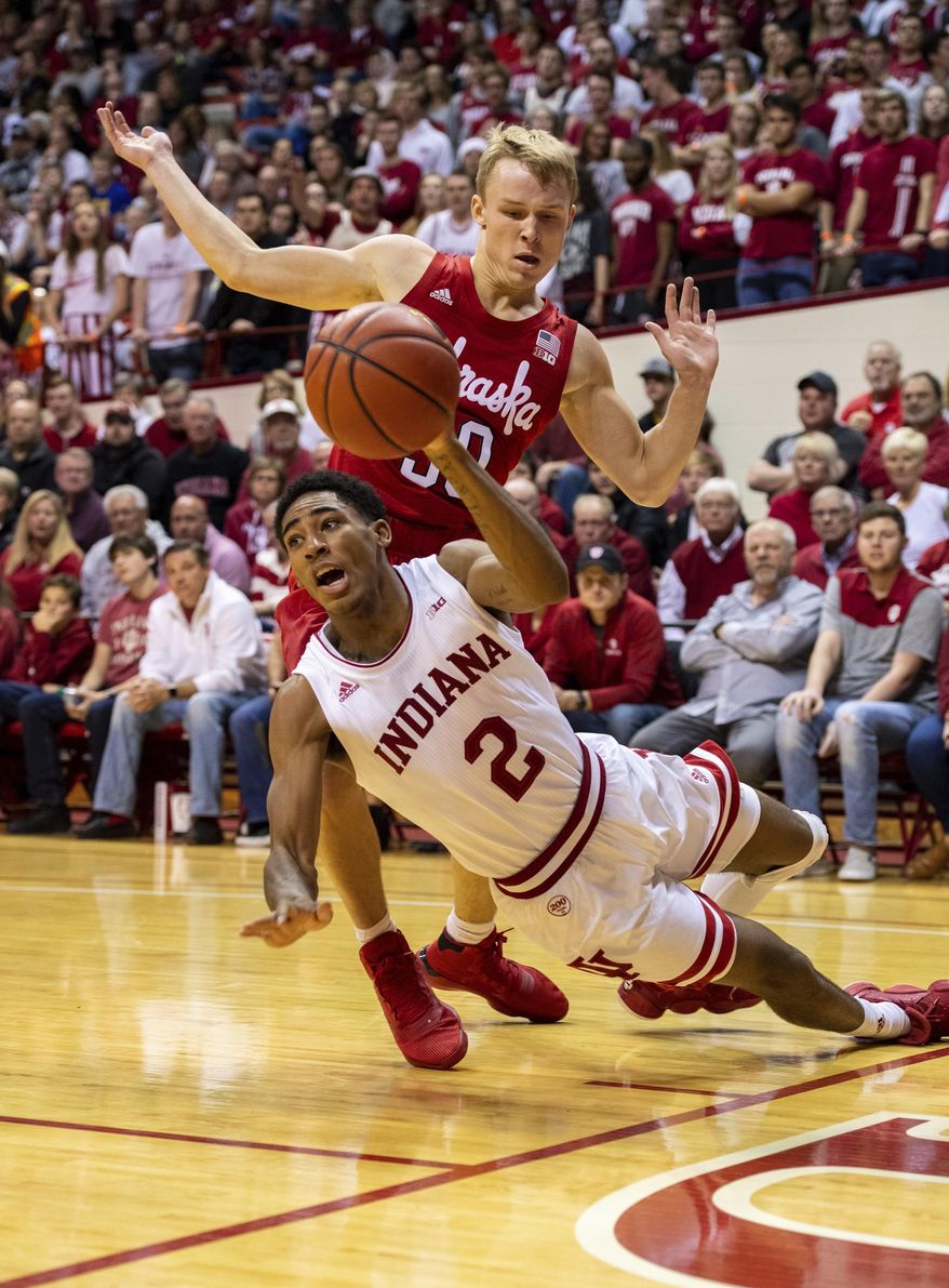 Indiana guard Armaan Franklin (2) tries to get a pass off to a teammate as he is defended by Nebraska guard Charlie Easley (30) along the baseline during the first half of an NCAA college basketball game, Friday, Dec. 13, 2019, in Bloomington, Ind. (AP Photo/Doug McSchooler)