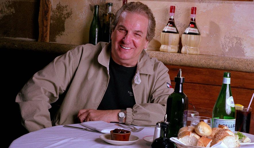In this July 28, 2001, photo, Danny Aiello poses for a photo at Gigino restaurant in New York. Aiello, the blue-collar character actor whose long career playing tough guys included roles in “Fort Apache, the Bronx,” "The Godfather, Part II," “Once Upon a Time in America” and his Oscar-nominated performance as a pizza man in Spike Lee’s "Do the Right Thing," has died. He was 86. Aiello died Thursday, Dec. 12, 2019 after a brief illness, said his publicist, Tracey Miller. (AP Photo/Jim Cooper) **FILE**