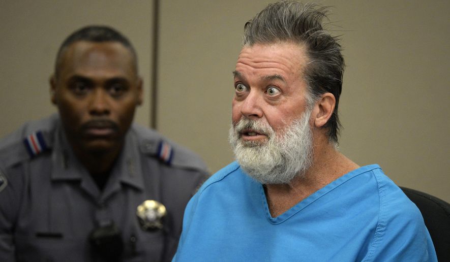 In this Dec. 9, 2015, file photo, Robert Lewis Dear talks to Judge Gilbert Martinez during a court appearance in Colorado Springs, Colo. Prosecutors are asking a judge to order a new mental evaluation for Dear who is accused of killing three people in a shooting at a Planned Parenthood clinic in Colorado. The request comes with Dear set to appear in U.S. District Court in Denver on Friday, Dec. 13, 2019, on new charges related to the 2015 Colorado Springs shooting. (Andy Cross/The Denver Post via AP, Pool, File) **FILE**
