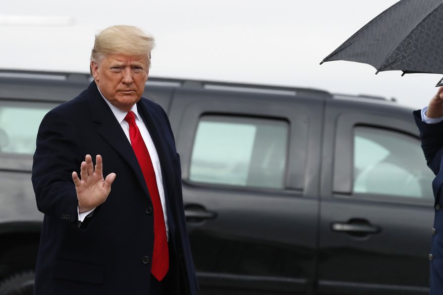 President Donald Trump waves as he exits a motorcade to board Air Force One at Andrews Air Force Base, Md., Saturday, Dec. 14, 2019, en route to Philadelphia to attend the Army-Navy football game. (AP Photo/Jacquelyn Martin) ** FILE **