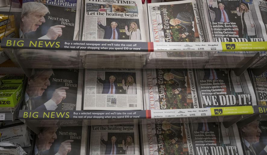 Newspapers sit on display for sale with their front pages reporting on the general election in a supermarket in south west London, Saturday, Dec. 14, 2019. Prime Minister Boris Johnson pledged Friday to heal Britain's divisions over Brexit after his gamble on early elections rewarded him with a commanding majority in Parliament and a new mandate to take his country out of the European Union at the end of January. (AP Photo/Matt Dunham)