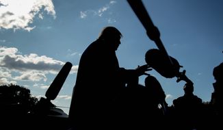 President Donald Trump speaks to reporters on the South Lawn of the White House in Washington, Friday, Nov. 8, 2019, before boarding Marine One for a short trip to Andrews Air Force Base, Md. and then on to Georgia to meet with supporters. (AP Photo/Andrew Harnik)