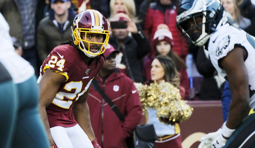 Washington Redskins cornerback Josh Norman (24) looks across the line of scrimmage during an NFL football game against the Philadelphia Eagles, Sunday, Dec. 15, 2019, in Landover, Md. (AP Photo/Mark Tenally) ** FILE **