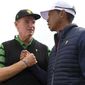 International team captain Ernie Els, left, shakes hands with U.S. team player and captain Tiger Woods after the U.S. team won the President&#39;s Cup golf tournament at Royal Melbourne Golf Club in Melbourne, Sunday, Dec. 15, 2019. The U.S. team won the tournament 16-14. (AP Photo/Andy Brownbill)