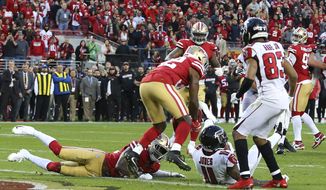 Atlanta Falcons wide receiver Julio Jones (11) sits next to the goal line after scoring against the San Francisco 49ers during the second half of an NFL football game in Santa Clara, Calif., Sunday, Dec. 15, 2019. (AP Photo/John Hefti)