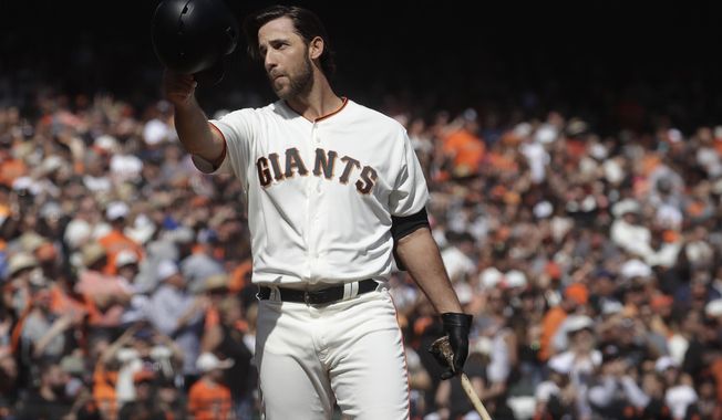FILE - In this Sunday, Sept. 29, 2019, file photo, San Francisco Giants&#x27; Madison Bumgarner waves toward fans before pinch hitting against the Los Angeles Dodgers during the fifth inning of a baseball game in San Francisco. The Giants plan to meet with the free agent left-hander’s representatives during the December 2019 baseball winter meetings in San Diego. (AP Photo/Jeff Chiu, File)