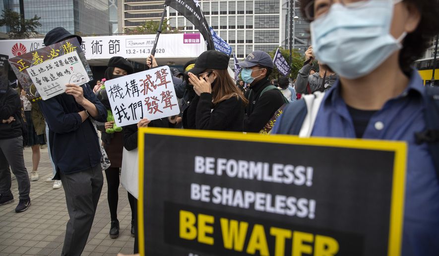 Protesters gather during a rally in Hong Kong, Sunday, Dec. 15, 2019. Hong Kong police said on Saturday that they have arrested three men for testing homemade explosives they suspect were intended for use during protests. (AP Photo/Mark Schiefelbein)