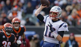 New England Patriots quarterback Tom Brady (12) passes in the first half of an NFL football game against the New England Patriots, Sunday, Dec. 15, 2019, in Cincinnati. (AP Photo/Gary Landers)