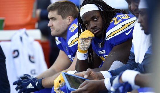 Los Angeles Chargers running back Melvin Gordon looks on from the sideline during the second half of an NFL football game against the Minnesota Vikings, Sunday, Dec. 15, 2019, in Carson, Calif. (AP Photo/Kelvin Kuo)