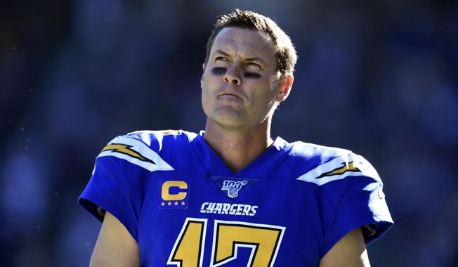 Los Angeles Chargers quarterback Philip Rivers looks on during the first half of an NFL football game against the Minnesota Vikings, Sunday, Dec. 15, 2019, in Carson, Calif. (AP Photo/Kelvin Kuo)