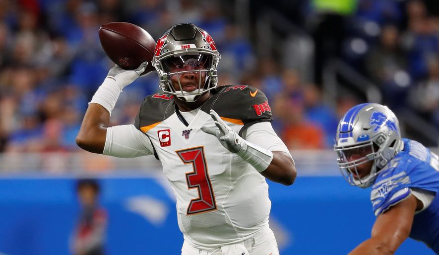 The Buccaneers' Jameis Winston on Sunday became the first quarterback to pass for at least 450 yards in back-to-back regular season games in the NFL. (ASSOCIATED PRESS)