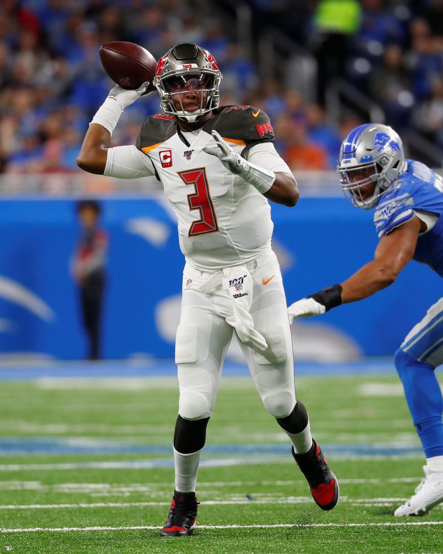 The Buccaneers' Jameis Winston on Sunday became the first quarterback to pass for at least 450 yards in back-to-back regular season games in the NFL. (ASSOCIATED PRESS)