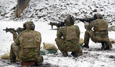 U.S. Soldiers assigned to 1st Battalion, 10th Special Forces Group (Airborne)  practice a variety of shooting techniques with their M4A1 rifles at Panzer Range Complex in Boebligen, Germany, Jan. 23, 2015.(U.S. Army photo by Visual Information Specialist Adam Sanders/Released)