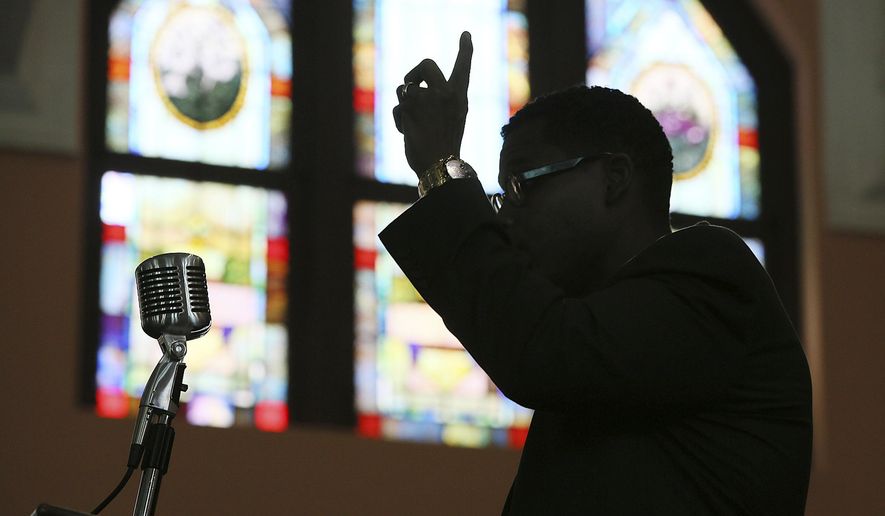 In this Wednesday, Aug. 28, 2013 file photo, Rev. Shanan Jones delivers a sermon at Ebenezer Baptist Church in Atlanta. According a study released on Monday, Dec. 16, 2019 by the Pew Research Center, the median length of U.S. sermons in April and May was 37 minutes. Catholic sermons were the shortest, at a median of just 14 minutes, compared with 25 minutes for sermons in mainline Protestant congregations and 39 minutes in evangelical Protestant congregations. Historically black Protestant churches had by far the longest sermons, at a median of 54 minutes. (Curtis Compton/Atlanta Journal-Constitution via AP)