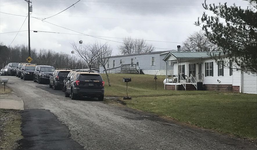 In this Sunday, Dec. 15, 2019, photo provided by WSAZ-TV, a home in rural Mason County, West Virginia, is shown where a sheriff's deputy was shot. Mason County Sheriff Greg Powers identified the deputy as Matt McCormick, a one-year employee with the department. (Tori Yorgey/WSAZ-TV via AP)