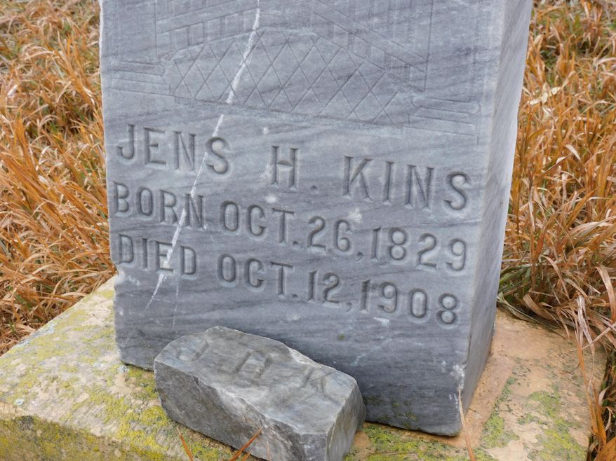 This tombstone and iron cross are located in what is known as the Three Graves Cemetery in McLean County, ND. While the tombstone bears an inscription of the deceased, there is no such identification on the cross. (Kim Fundingsland/Minot Daily News via AP)
