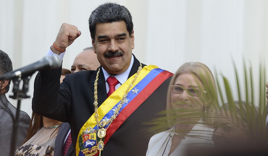 Venezuela&#39;s President Nicolas Maduro waves as he arrives at the National Constituent Assembly&#39;s building during the celebration rally of the 20th anniversary of the Venezuelan Constitution in Caracas, Venezuela, Sunday, Dec. 15, 2019. (AP Photo/Matias Delacroix) **FILE**