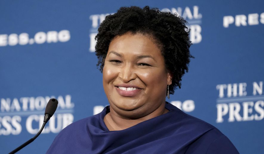 FILE - In this Nov. 15, 20-19 file photo, former Georgia House Democratic Leader Stacey Abrams, speaks at the National Press Club in Washington. A voting rights group founded by Democrat Stacey Abrams filed an emergency motion Monday, Dec. 16, 2019 asking a court to halt Georgia’s planned mass purge of voters. The motion was filed by Fair Fight Action in U.S. District Court, just hours before the secretary of state’s (AP Photo/Michael A. McCoy, File)