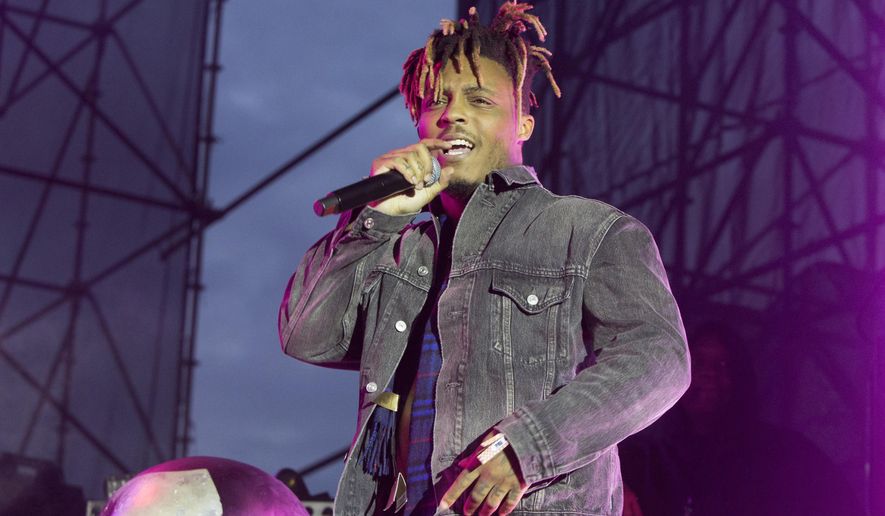 In this May 15, 2019, file photo, Juice WRLD performs in concert during his &quot;Death Race for Love Tour&quot; at The Skyline Stage at The Mann Center for the Performing Arts in Philadelphia. The Chicago-area rapper, whose real name is Jarad A. Higgins, was pronounced dead Dec. 8 after a &amp;quot;medical emergency&#39;&#39; at Chicago&#39;s Midway International Airport, according to authorities. (Photo by Owen Sweeney/Invision/AP, File)