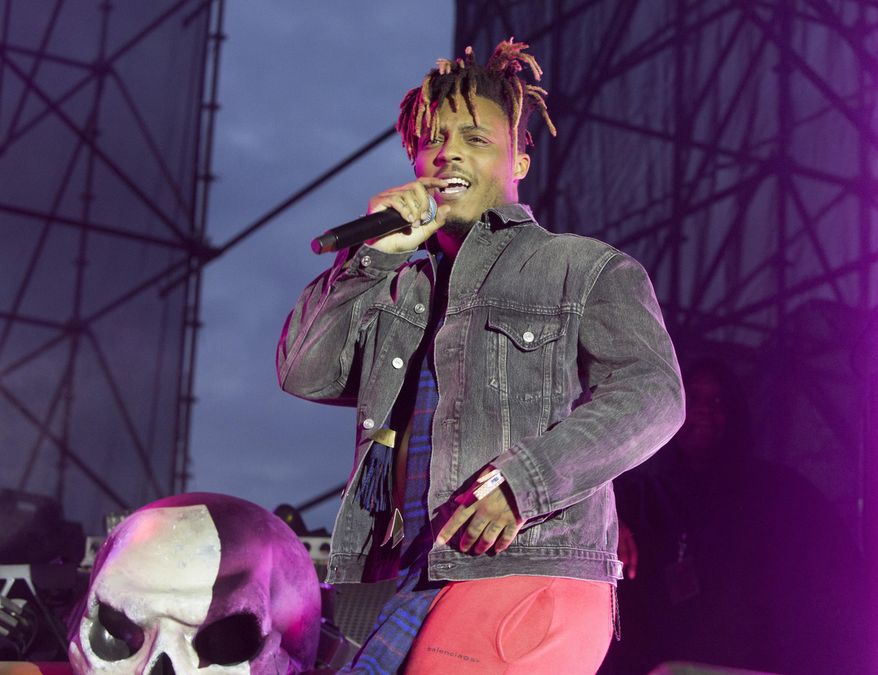 In this May 15, 2019, file photo, Juice WRLD performs in concert during his "Death Race for Love Tour" at The Skyline Stage at The Mann Center for the Performing Arts in Philadelphia. The Chicago-area rapper, whose real name is Jarad A. Higgins, was pronounced dead Dec. 8 after a "medical emergency'' at Chicago's Midway International Airport, according to authorities. (Photo by Owen Sweeney/Invision/AP, File)