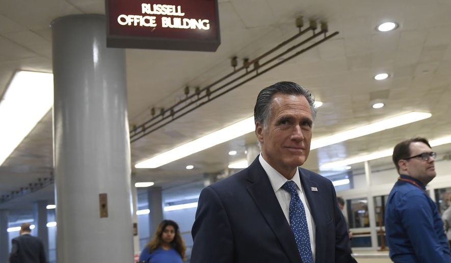 Sen. Mitt Romney, R-Utah, walks on Capitol Hill in Washington, Tuesday, Dec. 17, 2019. (AP Photo/Susan Walsh)