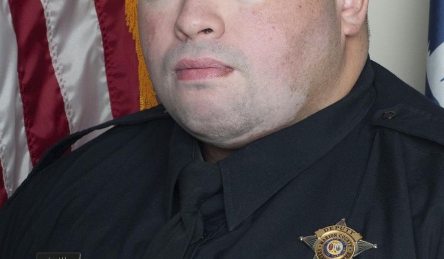 This undated image released by the Marion County, S.C, Sheriff's Office Pfc. Michael Shawn Latu, who died early Tuesday, Dec. 17, 2019, when the cruiser he was driving ran off the road and struck a bridge support just after 1 a.m., South Carolina Highway Patrol Cpl. Sonny Collins told news outlets. Latu was named Marion County Sheriff's Office 2018 Deputy of the Year and 2018 Patrolman of the Year, according to the Marion County Sheriff's office. (Marion County Sheriff's Office via AP)