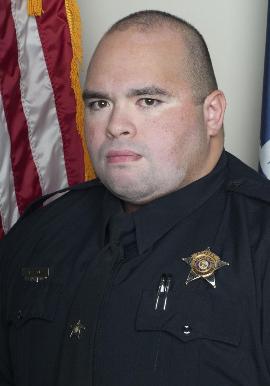 This undated image released by the Marion County, S.C, Sheriff's Office Pfc. Michael Shawn Latu, who died early Tuesday, Dec. 17, 2019, when the cruiser he was driving ran off the road and struck a bridge support just after 1 a.m., South Carolina Highway Patrol Cpl. Sonny Collins told news outlets. Latu was named Marion County Sheriff's Office 2018 Deputy of the Year and 2018 Patrolman of the Year, according to the Marion County Sheriff's office. (Marion County Sheriff's Office via AP)