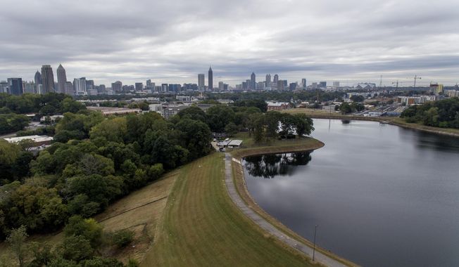 FILE - In this Oct. 15, 2019, file photo, reservoir No. 1, a 180 million-gallon water supply that has been out of service much of the past few decades, sits against the backdrop of the city skyline in Atlanta. U.S. Sen. Kirsten Gillibrand, D-N.Y., is proposing Tuesday, Dec. 17, 2019, to boost federal efforts to fortify the nation&#x27;s dams following an Associated Press investigation that found scores of potentially troubling dams around the country.  (AP Photo/David Goldman, File)