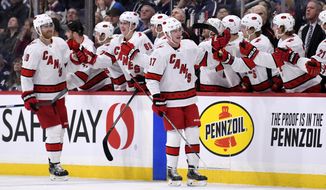 Carolina Hurricanes&#39; Andrei Svechnikov (37) celebrates his goal against the Winnipeg Jets with teammates during second period NHL hockey action in Winnipeg, Manitoba on Tuesday Dec. 17, 2019. (Fred Greenslade/The Canadian Press via AP)