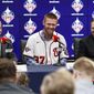 Washington Nationals pitcher Stephen Strasburg, center, smiles during a baseball media availability, accompanied by general manager Mike Rizzo, left, and agent Scott Boras, right, at Nationals Park, Tuesday, Dec. 17, 2019, in Washington. (AP Photo/Alex Brandon)