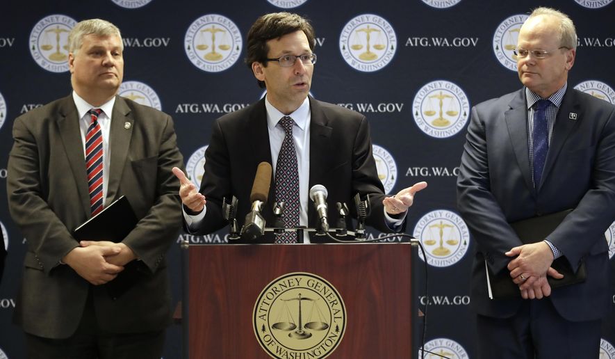 Washington state Attorney General Bob Ferguson, center, speaks as King County Prosecuting Attorney Dan Satterberg, left, and Thurston County Prosecuting Attorney Jon Tunheim look on during a news conference about Ferguson's lawsuit challenging a Trump Administration practice of ICE arrests at courthouses Tuesday, Dec. 17, 2019, in Seattle. Washington state has sued the Trump administration over its practice of arresting people at courthouses for immigration violations, saying it interferes with the state's authority to run its own judicial system. (AP Photo/Elaine Thompson)