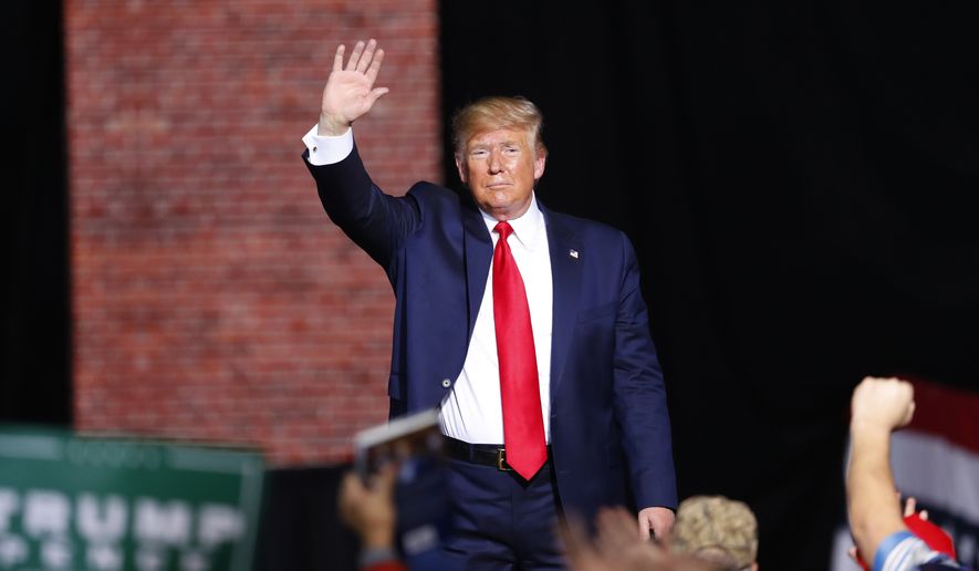 President Donald Trump waves at a campaign rally in Battle Creek, Mich., Wednesday, Dec. 18, 2019. (AP Photo/Paul Sancya)