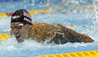 This Aug. 11, 2018, file photo shows U.S. swimmer Caeleb Dressel competing on his way to winning the men&#39;s 100m butterfly final during the Pan Pacific swimming championships in Tokyo.  In the post-Michael Phelps world, Dressel fits snugly into the successor&#39;s slot. Coming off two dynamic performances at the world swimming championships, Dressel figures to be one of the biggest stars at the 2020 Tokyo Games.  Yet he is reticent to step into the spotlight. (AP Photo/Koji Sasahara, File) **FILE**