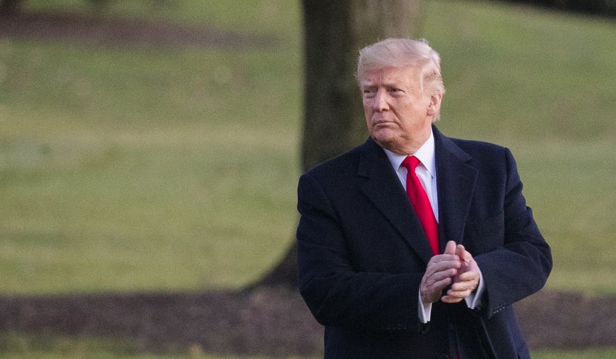 President Donald Trump glances at the cheering White House visitors and claps his hands as as he leaves the White House for a campaign trip to Battle Creek, Mich., Wednesday, Dec. 18, 2019, in Washington. Trump is on the cusp of being impeached by the House, with a historic debate set Wednesday on charges that he abused his power and obstructed Congress ahead of votes that will leave a defining mark on his tenure at the White House. (AP Photo/Manuel Balce Ceneta)