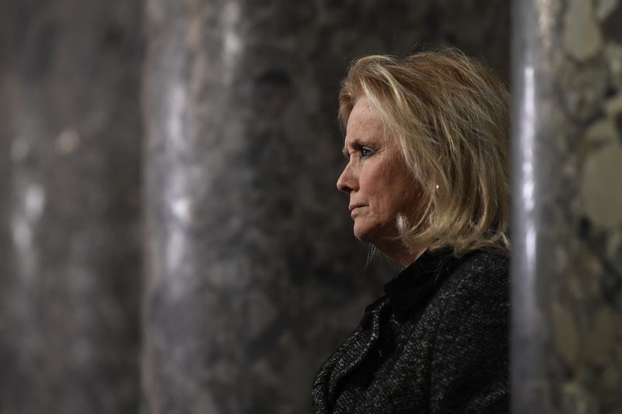 Rep. Debbie Dingell, D-Mich, speaks to reporters on Capitol Hill in Washington, Wednesday, Dec. 18, 2019. (AP Photo/Susan Walsh)